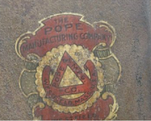 A worn and faded original Pope Manufacturing Company motorcycle decal